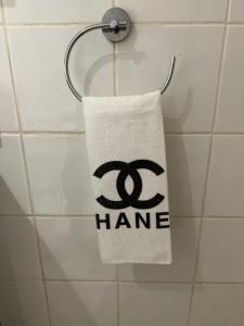 a towel hanging on a towel rack in a bathroom at 2 large bedroom apartment in central London in London
