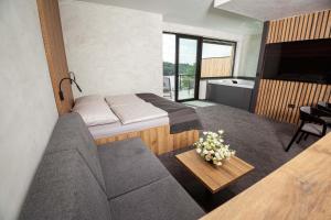 Ένα ή περισσότερα κρεβάτια σε δωμάτιο στο Hotel Kras