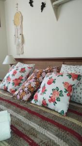 a bed with two pillows on top of it at La perla y el mar in Mar del Plata