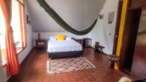Postel nebo postele na pokoji v ubytování Finca Turistica Rural El Descanso, privada Restrepo, Meta - Colombia