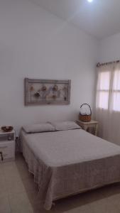 En eller flere senge i et værelse på Casa Isabella