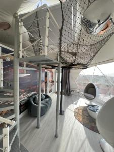 a living room with a ceiling with a net at Clear Sky Resorts - Grand Canyon - Unique Sky Domes in Valle