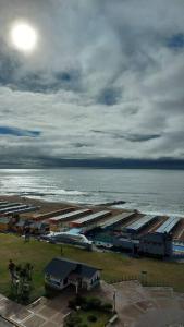 an aerial view of a parking lot next to the ocean at Peatonal al Mar in Miramar