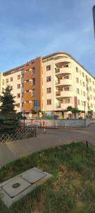 a large apartment building in front of a building at Warszawa Bemowo Pokoje in Warsaw