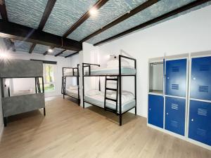 a room with three bunk beds in it at A TROITA HOSTEL Only Pilgrims Solo Peregrinos in Tui