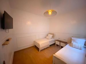 Postel nebo postele na pokoji v ubytování Appartement avec Terasse JACCUZI BARBECUE NETFLIX VUE SUR MER TOTALEMENT GRATUIT sans supplément
