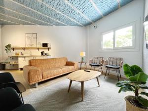 a living room with a couch and a table at A TROITA HOSTEL Only Pilgrims Solo Peregrinos in Tui