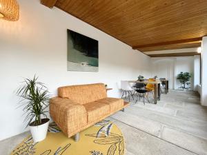a living room with a couch and a table at A TROITA HOSTEL Only Pilgrims Solo Peregrinos in Tui