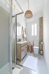 a bathroom with a shower and a sink and a toilet at Livemálaga San Agustín Suite & Terrace in Málaga