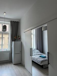 Ένα ή περισσότερα κρεβάτια σε δωμάτιο στο Apartament Obotrycka 9B