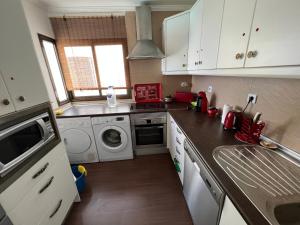 A kitchen or kitchenette at Panoramic Ocean View Apartment