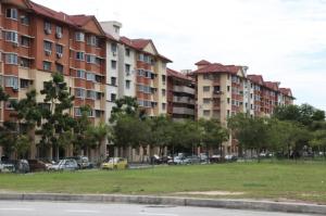 a row of apartment buildings with cars parked in a park at NAHARA HOMESTAY Carlina in Petaling Jaya