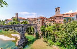 an old bridge over a river in a city at Awesome Home In Premariacco With Wifi in Premariacco