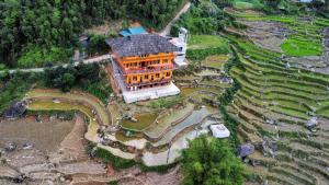 an overhead view of a large building in a field at Hmong Eco Villas in Sapa
