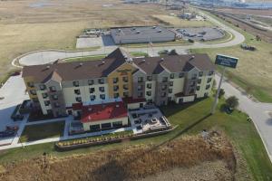 an aerial view of a building with a house at TownePlace Suites by Marriott Lincoln North in Lincoln