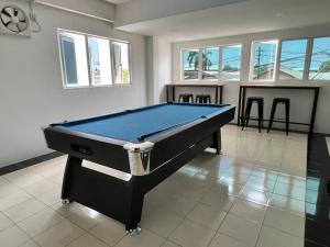 a pool table in a living room with at K SUITES HOTEL in Chabang Tiga