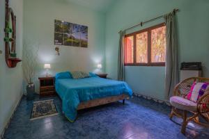 a bedroom with a bed and a window at San Lorenzo ByB in San Lorenzo