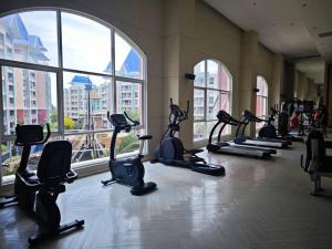a gym with a bunch of exercise bikes in a room at Grande Caribbean Resort in Pattaya South