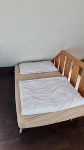 two beds sitting next to each other in a room at M-Hostel in Luzern