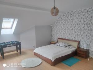Posteľ alebo postele v izbe v ubytovaní Apartament przy Słonecznej