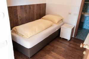 Voodi või voodid majutusasutuse Albergo Garni Orchidea toas
