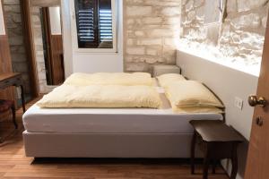 Voodi või voodid majutusasutuse Albergo Garni Orchidea toas