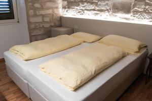 Voodi või voodid majutusasutuse Albergo Garni Orchidea toas