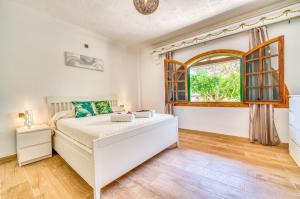 Posteľ alebo postele v izbe v ubytovaní Ideal Property Mallorca - Villa Xisco