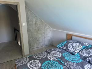 Łóżko lub łóżka w pokoju w obiekcie Villa Lipowe Wzgórze