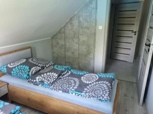 Łóżko lub łóżka w pokoju w obiekcie Villa Lipowe Wzgórze