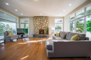 a living room with a couch and a tv at First Estate Winery in Peachland