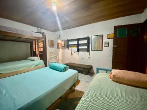 a bedroom with two beds in a room at Matilda Ec in Vilcabamba