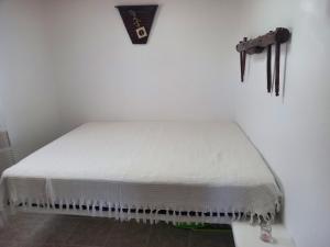 a white mattress sitting on a table in a room at Νύμφη in Kimolos