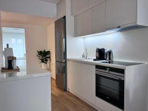 Кухня или кухненски бокс в Danube22 Apartment
