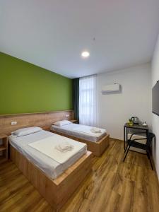 Postel nebo postele na pokoji v ubytování Hotel mia Telavi