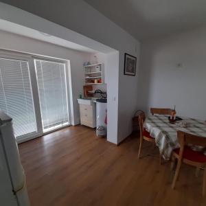 a living room with a table and a dining room at Lily of the valley house in Varaždinske Toplice