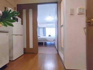 Posteľ alebo postele v izbe v ubytovaní K Shinjuku area-MAX 4p-新宿中心地域-步行可到新宿大久保歌舞伎町-可住4人