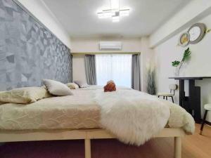 Posteľ alebo postele v izbe v ubytovaní K Shinjuku area-MAX 4p-新宿中心地域-步行可到新宿大久保歌舞伎町-可住4人