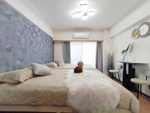Posteľ alebo postele v izbe v ubytovaní K Shinjuku area-MAX 4p-新宿中心地域-步行可到新宿大久保歌舞伎町-可住4人