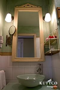 a bathroom with a sink and a mirror at Hotel Casona del Sella in Arriondas