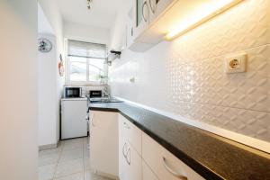Кухня или мини-кухня в Charming little apartment
