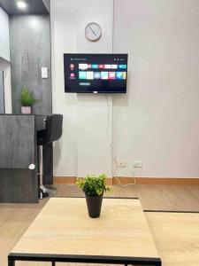 a potted plant sitting on a table in an office at 2BR SMDC Trees w/Netflix&WIFI near the POOL. T65F in Manila