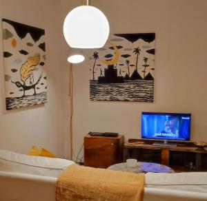 a living room with a couch and a tv at nice flat under the castle in Bratislava