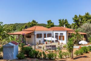 a villa with a view of the house at CalmNature in Agnontas