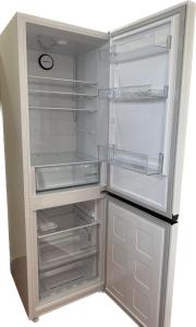 a white refrigerator with its door open with its door at Alvor Seven 10 in Alvor