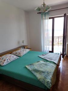 Ένα ή περισσότερα κρεβάτια σε δωμάτιο στο Summer 4