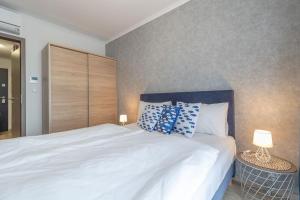 Postel nebo postele na pokoji v ubytování Cruiser Apartmanok Siófok By BLTN