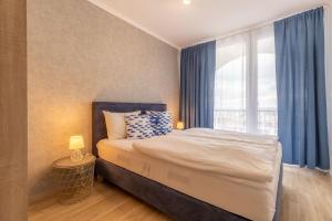 Postel nebo postele na pokoji v ubytování Cruiser Apartmanok Siófok By BLTN