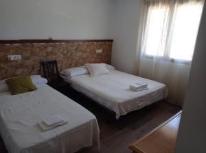 Postel nebo postele na pokoji v ubytování La Via Verde