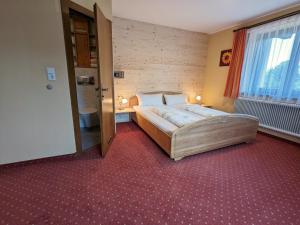 Uma cama ou camas num quarto em Pension Handle